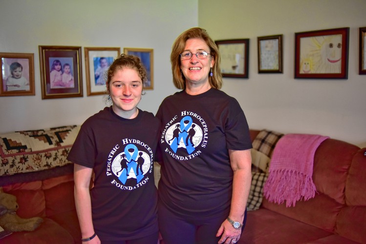 Bella Sacharczk, left, and her mother Denise Sacharzk pose for a photo Thursday, Sept. 22, in her home in Westhampton. Bella Sacharczk has hydrocephalus a condition in which fluid accumulates in the brain and on Saturday at Hampshire Regional High School they will be walking to raise awareness and money for research.